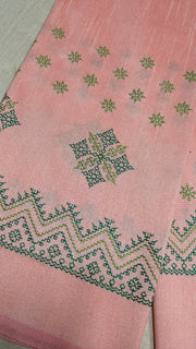 Peach with green kasuti blouse front view highlighting embroidered motifs